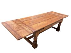 An 18th style rectangular oak draw leaf refectory dining table by John Capon of Norwich with cleated