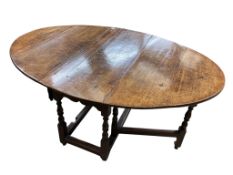 An 18th century oak gateleg table, width 120cm, length 148cm extended, height 70cm