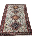 A Soumak ivory ground rug woven with birds and animals, 186 x 122cm