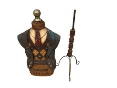 A decorative valet stand for ‘Blackheat Golf Club’, width 48cm, height 89cm together with a stand