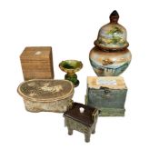 Four oriental pottery pieces to include a Chinese pillow and Buddhistic pedestal cup, together