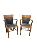 A pair of early 20th century oak office chairs, width 57cm, depth 46cm, height 84cm