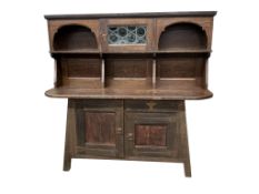 A Liberty ‘Culloden' oak sideboard with leaded glazed upper door, width 190cm, depth 64cm, height