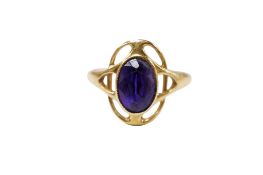 An early 20th century Art Nouveau 18ct and singe stone amethyst set ring, maker M.B.C., size Q,