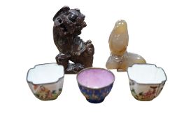 Three Canton enamel cups, an agate carving of a bird and a soapstone lion, largest 9.5cm high