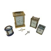 A Charles Frodsham carriage clock, a Matthew Norman oval miniature carriage clock, and two others,