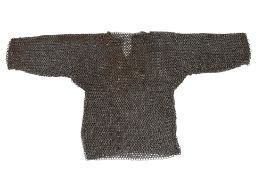 An apprentice made chain-mail vest, height 26cm.
