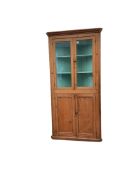 An early 19th century standing pine corner cupboard, width 96cm, depth 51cm, height 200cm