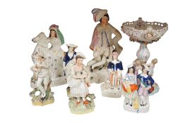 Seven 19th century Staffordshire figures to include Empress of France, height 28cm and a Dresden