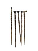 Welsh Folk Art - a group of five carved wood walking sticks, circa 1920-30s, comprising one with