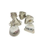 A collection of six late Victorian cheese domes and covers decorated with flowers, ivy and