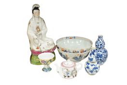 A group of seven pieces of Chinese porcelain to include a seated female figure, two blue and white