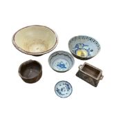 A Victorian glazed pottery dairy bowl, diameter 35cm, two English Delft bowls, Worcester saucer