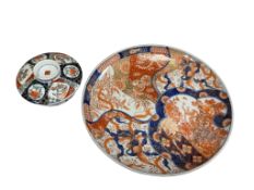 A Japanese Imari porcelain charger and a similar lidded bowl, largest 31cm in diameter