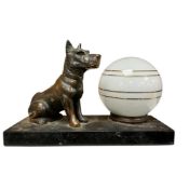 A French Art Deco style bronzed spelter Terrier table lamp with opaque glass shade, height 14cm.