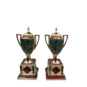 A pair of large Vienna style urns and pedestals, painted with classical figures, 50cm high