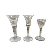 A George II ‘drawn trumpet’ wine glass and 2 other 18th century wine glasses, tallest 17cm