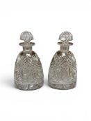 A pair of heavy Bohemian cut glass decanters with stoppers, height 28cm