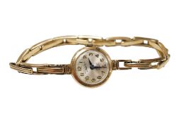 A lady's 9ct gold Everite manual wind wrist watch, with Arabic dial, on a 9ct gold expanding