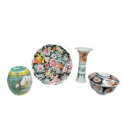 A Chinese Doucai porcelain trumpet vase, height 18.5cm, a famille noire dish and two lidded jars.