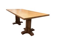 A mid century Heals style rectangular oak dining table and eight chairs, two with arms, table
