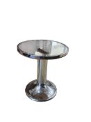 A French 1960’s chrome and glass circular table, diameter 57cm, height 63cm
