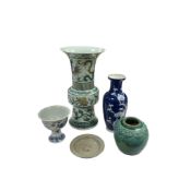 Five pieces of Chinese pottery and porcelain to include a prunus flower vase, blue and white stem