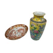 A Japanese famille rose, yellow ground vase, height 24cm, an oval ‘dragon’ dish, a pair of saucer
