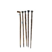 Welsh Folk Art - a group of five carved wood walking sticks, circa 1920-30s, comprising one with