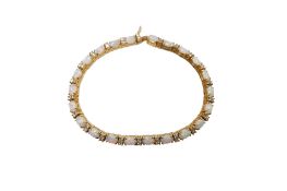 A recent 14k, whiye opal and diamond cluster set line bracelet, 18.8cm, gross weight 16 grams.