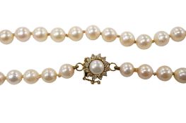 A single row cultured pearl necklace, with 14k, cultured pearl and diamond cluster set clasp, 46cm.