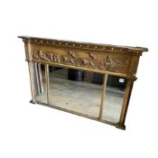 A Regency giltwood and composition triple plate overmantel mirror with classical tablet frieze,