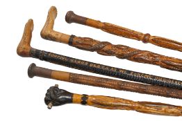 Welsh Folk Art - a group of five carved wood walking sticks, circa 1920-30s, comprising one with