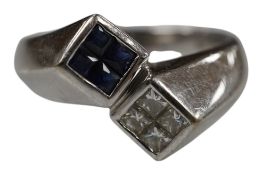 A white metal(stamped 14kt) diamond and sapphire set double cluster crossover ring, size N, gross
