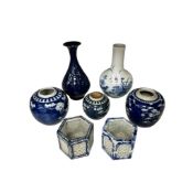 Seven pieces of Chinese porcelain comprising three prunus flower ginger jars, two blue and white