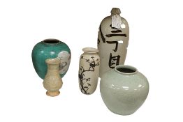 Five pieces of Chinese and Japanese pottery and porcelain to include a sake bottle, 18th/19th