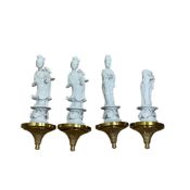 A set of four Chinese Blanc de chine figures with gilt metal wall mounts, 33cm high (4)