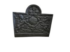 A cast iron fireback, width 71cm, height 62cm