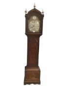 An 18th century mahogany longcase clock with arched brass dial and silvered chapter ring, the
