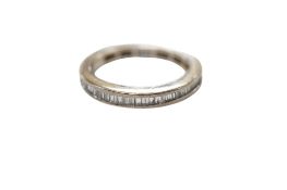 A diamond eternity ring, channel-set with baguette diamonds totalling approximately 1.10 carats,