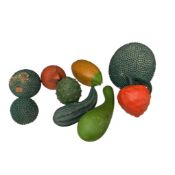 A collection of late 19th/early 20th century cold painted terracotta models of exotic fruits,