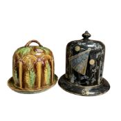 A Victorian majolica cheese dome and cover, height 26cm, and a Victorian Aesthetic Movement black
