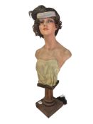 An early 20th century French female bust wig mannequin on wooden plinth, 90cm high