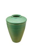 Keith Murray for Wedgwood, a matt green glazed ribbed conical vase, height 27cm.