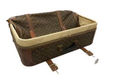 A Louis Vuitton monogram canvas soft suitcase, with tan leather straps and brass hardware, 65 x 45 x