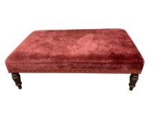 Lawson Wood, a red upholstered footstool, width 131cm, depth 80cm, height 45cm