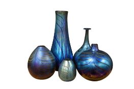 Five Siddy Langley iridescent blue glass vases, largest 29cm high.