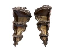 A pair of Italian giltwood corner shelves, height 90cmProvenance - the estate of a former antique