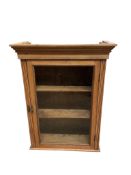 A glazed pine single door wall cabinet, width 71cm, depth 30cm, height 92cm