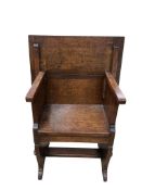 An oak monk's chair / table, width 69cm, depth 53cm, height 95cm